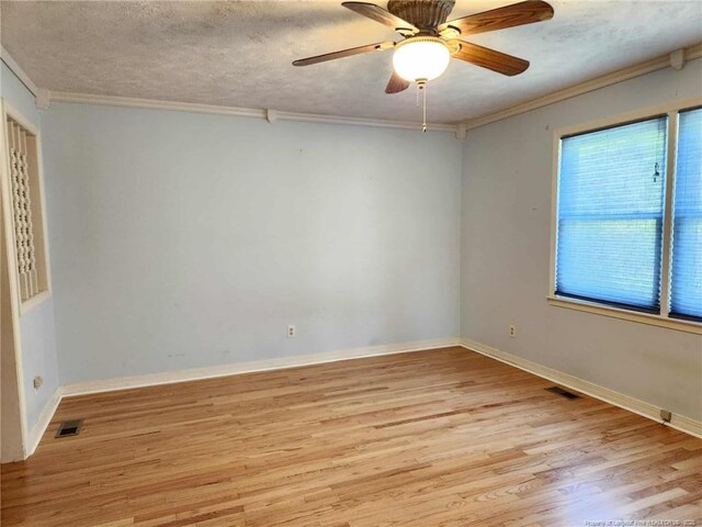 1519 Palmer Dr, Fayetteville, NC 28303 - spare room featuring light wood finished floors, ornamental molding, a textured ceiling, and ceiling fan