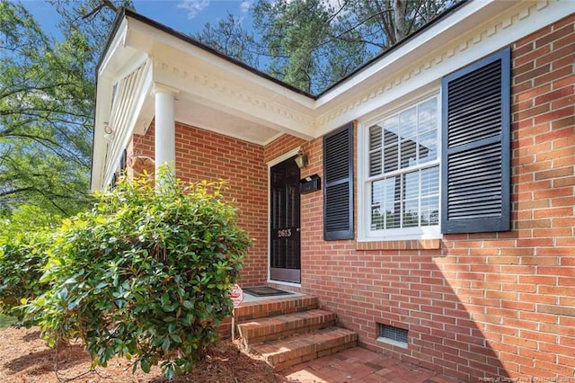 2613 N Edgewater Dr, Fayetteville, NC 28303 - view of exterior entry with brick siding and crawl space
