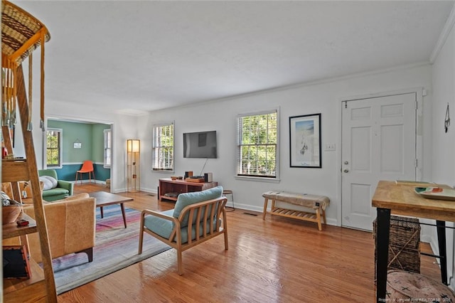 2613 N Edgewater Dr, Fayetteville, NC 28303 - living area featuring light wood-type flooring and crown molding