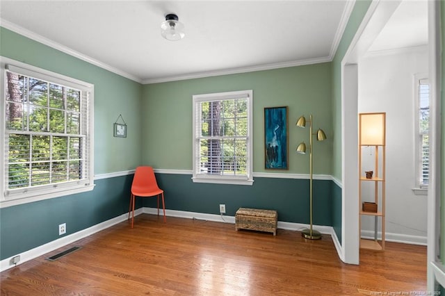 2613 N Edgewater Dr, Fayetteville, NC 28303 - sitting room with healthy amount of natural light, crown molding, and wood finished floors