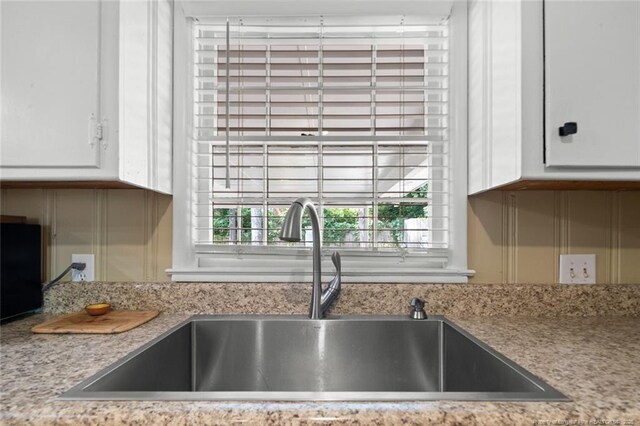 2613 N Edgewater Dr, Fayetteville, NC 28303 - kitchen view of a sink and white cabinets