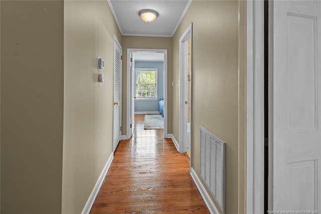 2613 N Edgewater Dr, Fayetteville, NC 28303 - corridor with ornamental molding and wood finished floors