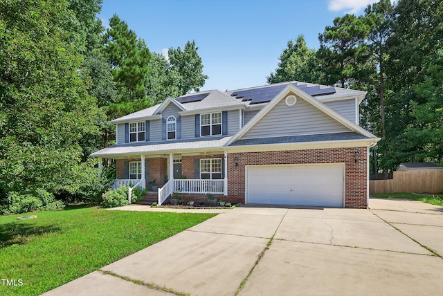 1205 Magnolia Hill Rd, Garner, NC 27529 - view of front facade with covered porch, driveway, brick siding, a garage, and roof mounted solar panels