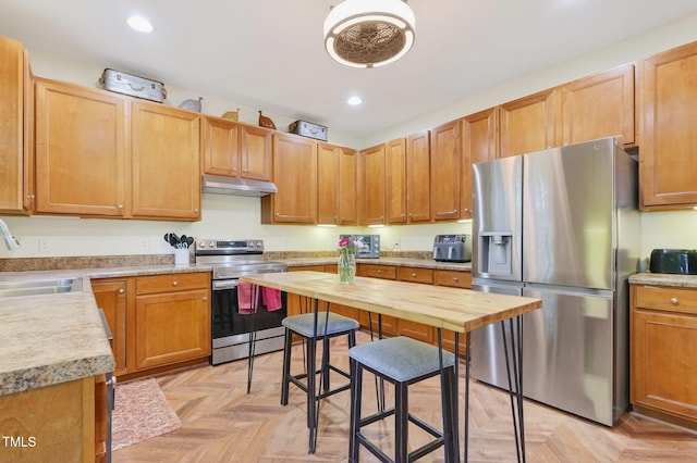1205 Magnolia Hill Rd, Garner, NC 27529 - kitchen with appliances with stainless steel finishes, under cabinet range hood, and recessed lighting