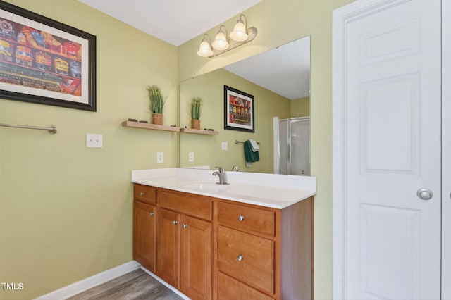 1205 Magnolia Hill Rd, Garner, NC 27529 - bathroom featuring a stall shower, vanity, and wood finished floors