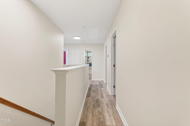 1205 Magnolia Hill Rd, Garner, NC 27529 - corridor with light wood-style floors and an upstairs landing