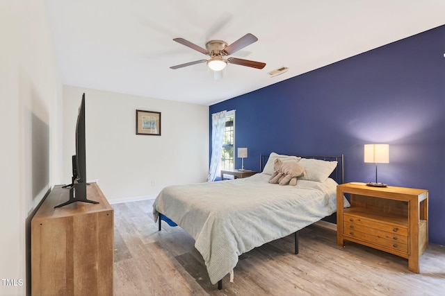 1205 Magnolia Hill Rd, Garner, NC 27529 - bedroom featuring wood finished floors and a ceiling fan
