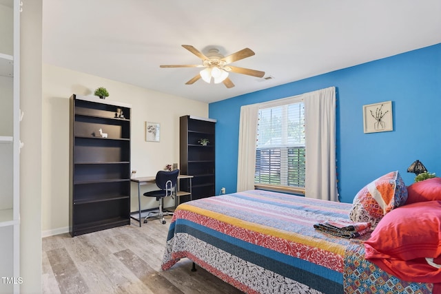1205 Magnolia Hill Rd, Garner, NC 27529 - bedroom featuring wood finished floors, an office area, and a ceiling fan