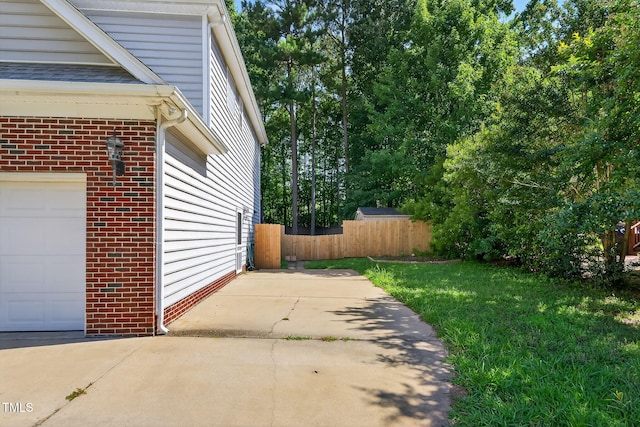 1205 Magnolia Hill Rd, Garner, NC 27529 - view of side of property with a garage and brick siding