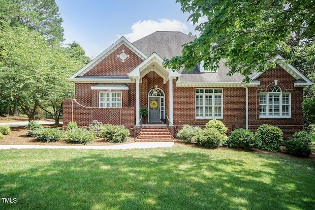 109 Fox Trap Ct, Garner, NC 27529 - view of front facade featuring a front yard, brick siding, and roof with shingles