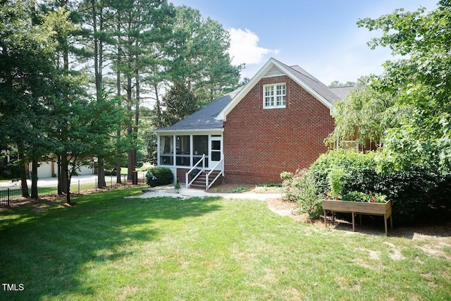 109 Fox Trap Ct, Garner, NC 27529 - rear view of property featuring a sunroom and a shingled roof