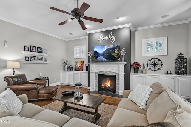 101 Tatum Ct, Holly Springs, NC 27540 - living room featuring dark wood-type flooring, ornamental molding, a ceiling fan, a fireplace, and recessed lighting