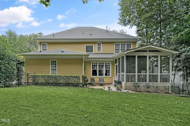 101 Tatum Ct, Holly Springs, NC 27540 - rear view of house with a sunroom, a patio, and roof with shingles