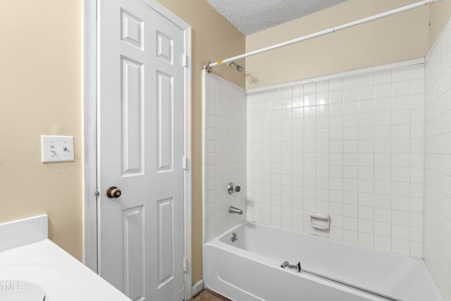 1320 Park Glen Dr Unit 204, Raleigh, NC 27610 - bathroom with washtub / shower combination, vanity, and a textured ceiling