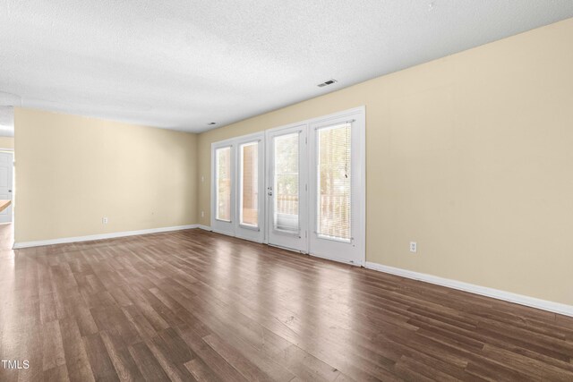 1320 Park Glen Dr Unit 204, Raleigh, NC 27610 - unfurnished room featuring dark wood-style flooring and a textured ceiling