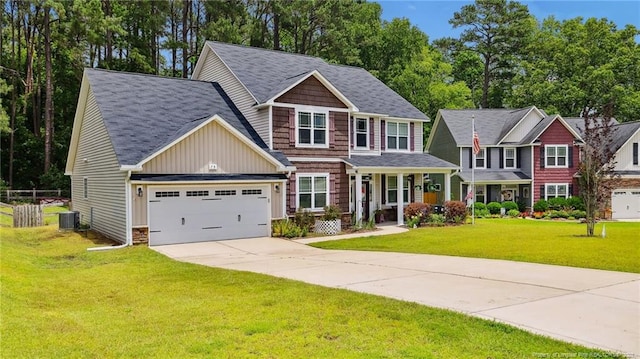 75 Bynum Ct, Carthage, NC 28327 - view of front of house featuring concrete driveway, board and batten siding, a front lawn, a garage, and covered porch