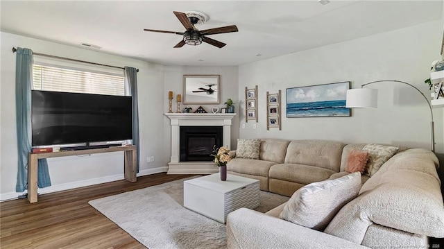 75 Bynum Ct, Carthage, NC 28327 - living room with ceiling fan, wood finished floors, and a glass covered fireplace