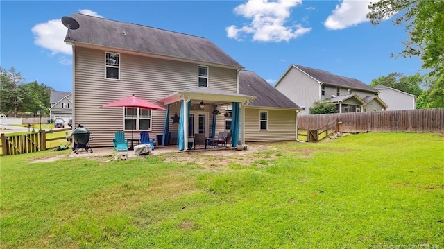 75 Bynum Ct, Carthage, NC 28327 - back of property featuring ceiling fan, a patio area, and a fenced backyard