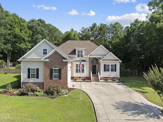 55 Kristopher Woods Dr, Youngsville, NC 27596 - traditional-style house with brick siding, a front yard, driveway, and crawl space