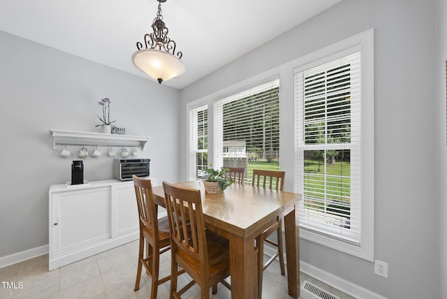55 Kristopher Woods Dr, Youngsville, NC 27596 - dining area with baseboards and light tile patterned floors