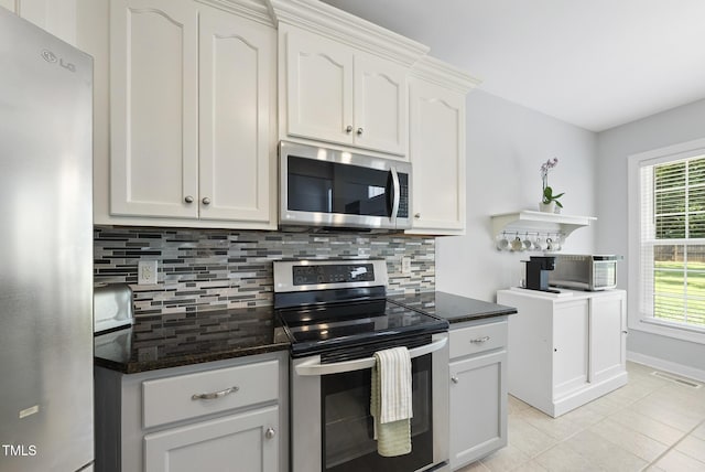 55 Kristopher Woods Dr, Youngsville, NC 27596 - kitchen with appliances with stainless steel finishes, tasteful backsplash, open shelves, and white cabinets