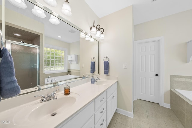 55 Kristopher Woods Dr, Youngsville, NC 27596 - full bathroom featuring double vanity, a bath, tile patterned floors, and a shower stall