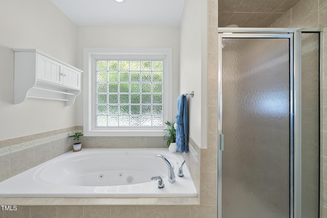 55 Kristopher Woods Dr, Youngsville, NC 27596 - bathroom featuring a jetted tub and a shower stall