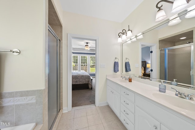 55 Kristopher Woods Dr, Youngsville, NC 27596 - ensuite bathroom with double vanity, tile patterned flooring, a stall shower, and a ceiling fan