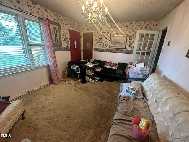 625 Revell Rd, Selma, NC 27576 - carpeted living area with wallpapered walls, a chandelier, and a textured ceiling
