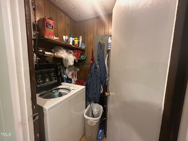 625 Revell Rd, Selma, NC 27576 - laundry room featuring a textured ceiling, washer / clothes dryer, and wood walls
