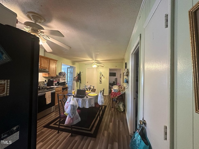 625 Revell Rd, Selma, NC 27576 - kitchen featuring appliances with stainless steel finishes, ceiling fan, a textured ceiling, dark wood-type flooring, and under cabinet range hood