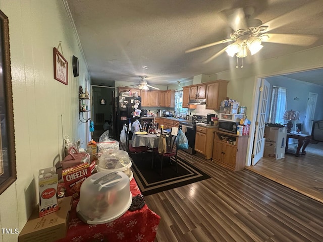 625 Revell Rd, Selma, NC 27576 - dining area featuring a ceiling fan, dark wood-type flooring, and a textured ceiling