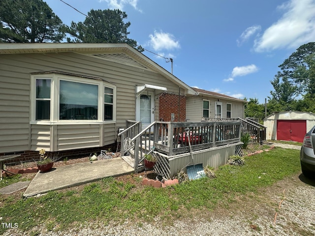 625 Revell Rd, Selma, NC 27576 - view of front facade with a storage unit and a front lawn