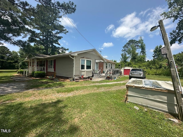 625 Revell Rd, Selma, NC 27576 - view of front facade featuring a front yard and a porch