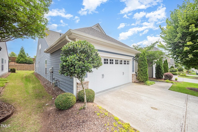 1204 E Rosedale Creek Dr, Durham, NC 27703 - view of property exterior featuring concrete driveway, a shingled roof, a yard, and an attached garage