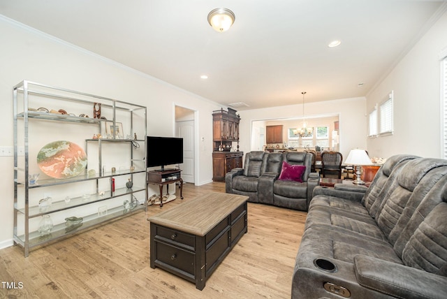 1204 E Rosedale Creek Dr, Durham, NC 27703 - living room with a chandelier, light wood finished floors, crown molding, and recessed lighting