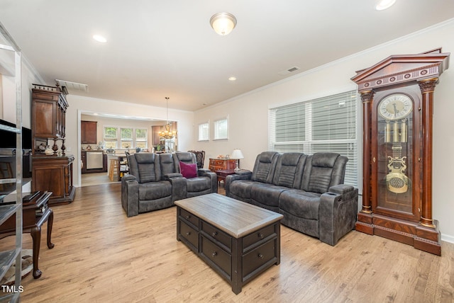 1204 E Rosedale Creek Dr, Durham, NC 27703 - living room featuring a chandelier, crown molding, light wood-style flooring, and recessed lighting