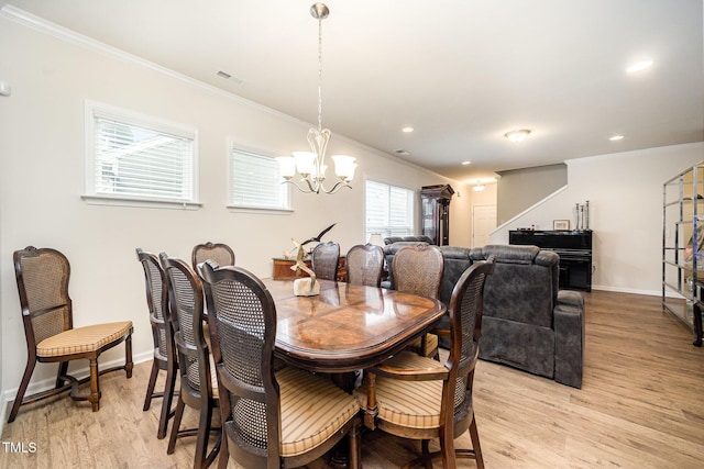 1204 E Rosedale Creek Dr, Durham, NC 27703 - dining space with ornamental molding, a chandelier, light wood-style floors, and recessed lighting