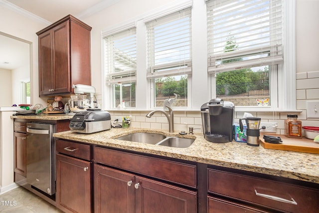 1204 E Rosedale Creek Dr, Durham, NC 27703 - kitchen with decorative backsplash, light stone countertops, dishwasher, and ornamental molding