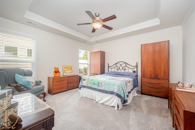 1204 E Rosedale Creek Dr, Durham, NC 27703 - bedroom featuring a raised ceiling, light carpet, ornamental molding, and a ceiling fan