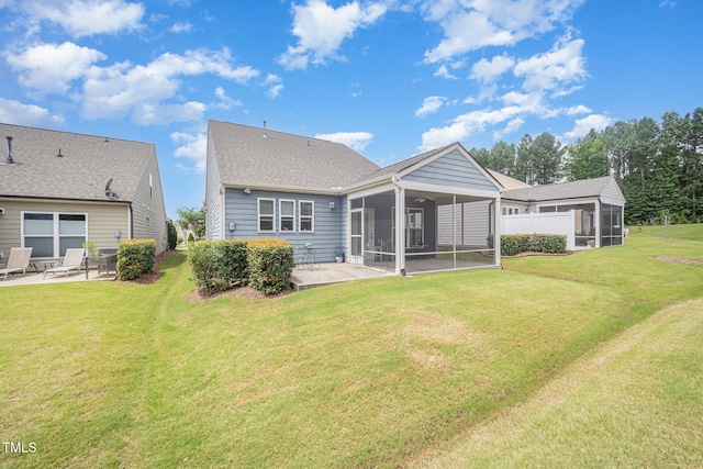1204 E Rosedale Creek Dr, Durham, NC 27703 - back of property featuring a sunroom, a patio, and a yard