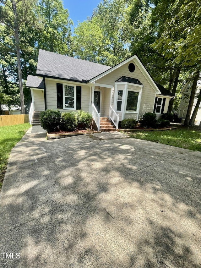 5 Sue Ann Ct, Durham, NC 27704 - view of front of property with driveway and roof with shingles