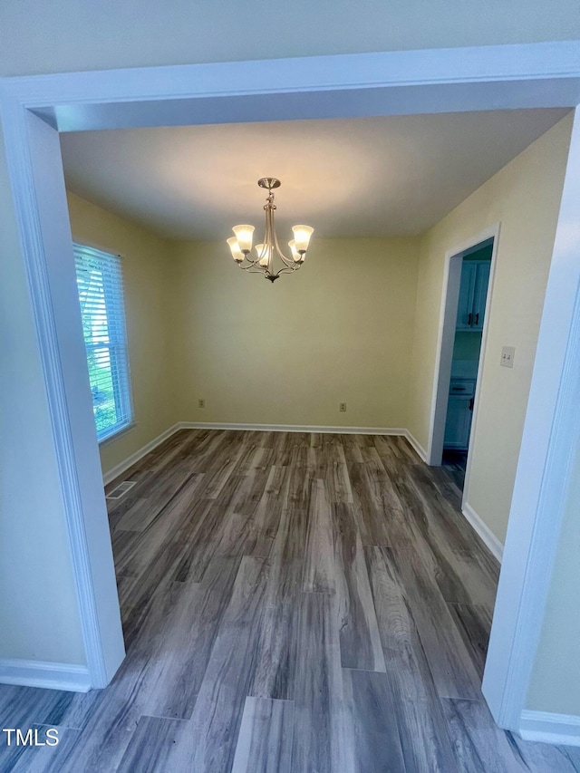 5 Sue Ann Ct, Durham, NC 27704 - unfurnished dining area featuring dark wood-style floors and a chandelier