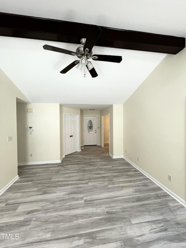 5 Sue Ann Ct, Durham, NC 27704 - unfurnished living room with estacked washer and dryer, ceiling fan, and light wood-type flooring