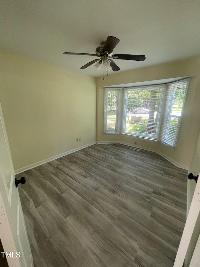 5 Sue Ann Ct, Durham, NC 27704 - empty room with ceiling fan and wood finished floors