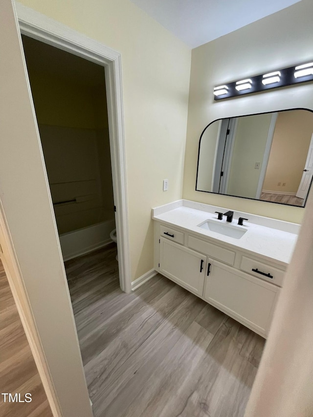 5 Sue Ann Ct, Durham, NC 27704 - full bath with wood finished floors, vanity, and a bathtub