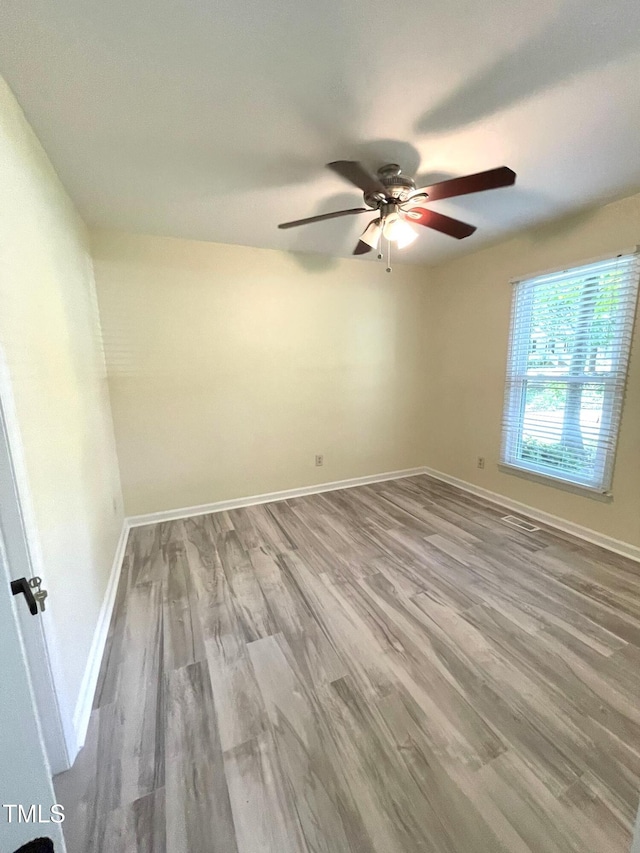 5 Sue Ann Ct, Durham, NC 27704 - empty room with a ceiling fan and wood finished floors
