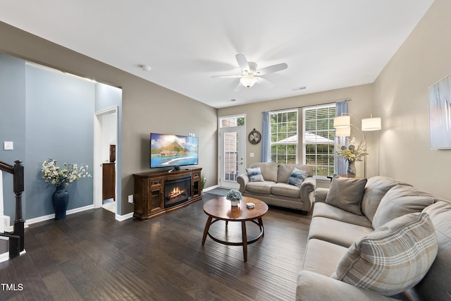 605 Smallwood Dr, Durham, NC 27703 - living area featuring dark wood finished floors, ceiling fan, and a glass covered fireplace