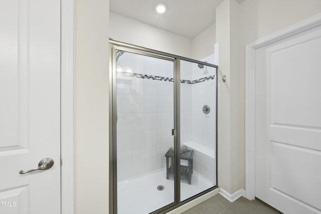 605 Smallwood Dr, Durham, NC 27703 - bathroom with a stall shower and tile patterned floors