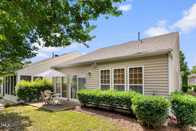 575 Tomkins Loop, Cary, NC 27519 - rear view of house with a patio area, roof with shingles, and a lawn